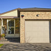 Image of motion detector strobe light installed on a garage wall